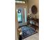 Beautiful foyer featuring stylish decor, a lamp and front door in view at 23598 Awabuki Dr # 102, Venice, FL 34293