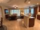 Open-concept living room with high ceilings and access to an outdoor patio at 23598 Awabuki Dr # 102, Venice, FL 34293
