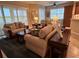 A living room with two sofas and a glass door to the outdoor water view at 23598 Awabuki Dr # 102, Venice, FL 34293