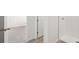 This bathroom is equipped with a white tiled shower and neutral color scheme at 145 Lazy Shore Dr, Nokomis, FL 34275