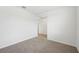 Bedroom featuring neutral carpet and an entrance to the living room at 145 Lazy Shore Dr, Nokomis, FL 34275