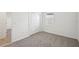 Neutral bedroom featuring carpeted floors and a double door closet at 145 Lazy Shore Dr, Nokomis, FL 34275