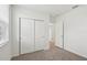 Bedroom featuring plush carpet and a large window at 145 Lazy Shore Dr, Nokomis, FL 34275