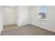 Bedroom featuring neutral carpet and natural light at 145 Lazy Shore Dr, Nokomis, FL 34275