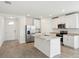 Bright, modern kitchen featuring stainless steel appliances, granite countertops, and a functional center island at 145 Lazy Shore Dr, Nokomis, FL 34275
