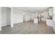 Spacious open-concept kitchen with granite countertops and stainless steel appliances leading into living area at 145 Lazy Shore Dr, Nokomis, FL 34275