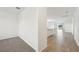 Open concept living room with tiled floors and sliding glass doors with backyard view at 145 Lazy Shore Dr, Nokomis, FL 34275