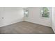 Bright bedroom with carpeted floors and large windows at 156 Lazy Shore Dr, Nokomis, FL 34275