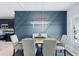 Dining area with wood table and geometric wall detail at 2148 Adirondack Ln, Port Charlotte, FL 33953