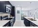 Modern kitchen with stainless steel appliances and white counters at 27367 Chinquapin Dr, Punta Gorda, FL 33955