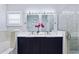 Modern bathroom with double vanity and soaking tub at 27367 Chinquapin Dr, Punta Gorda, FL 33955