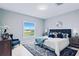Spacious bedroom with large window and en-suite bathroom at 27367 Chinquapin Dr, Punta Gorda, FL 33955