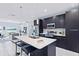 Modern kitchen with island and stainless steel appliances at 27367 Chinquapin Dr, Punta Gorda, FL 33955