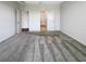 Primary bedroom with carpet flooring and access to bathroom and hallway at 12545 Ryegrass Loop, Parrish, FL 34219