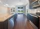 Kitchen island with granite countertop and stainless steel appliances at 12545 Ryegrass Loop, Parrish, FL 34219