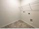 Laundry room with tile flooring and wire shelving at 12545 Ryegrass Loop, Parrish, FL 34219