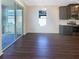 Bright dining room with hardwood floors and sliding glass doors to patio at 12545 Ryegrass Loop, Parrish, FL 34219