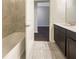 Bathroom with a bathtub and double vanity at 12545 Ryegrass Loop, Parrish, FL 34219
