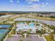 Community pool, tennis courts, and clubhouse at 5520 Limelight Dr, Apollo Beach, FL 33572