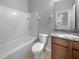 Clean bathroom, granite vanity, and a bathtub shower combo at 8110 Enclave Way # 101, Sarasota, FL 34243