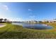 Peaceful pond surrounded by lush greenery and homes at 9111 Isabella Cir, Parrish, FL 34219