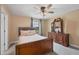 Bright bedroom with a queen-size bed and a wooden dresser at 9111 Isabella Cir, Parrish, FL 34219