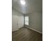 Well-lit bedroom with double closets and wood-look floors at 5410 Tughill Dr, Tampa, FL 33624