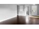 Bright living room with dark hardwood floors and an open floor plan at 11158 Golden Silence Dr, Riverview, FL 33579