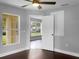 Bright bedroom with a window and door leading to another room at 11158 Golden Silence Dr, Riverview, FL 33579