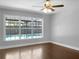 Bright bedroom with large windows overlooking the pool at 11158 Golden Silence Dr, Riverview, FL 33579