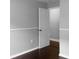Bedroom with a door leading to another room and dark hardwood floors at 11158 Golden Silence Dr, Riverview, FL 33579