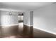 Spacious living room with hardwood floors and geometric wall at 11158 Golden Silence Dr, Riverview, FL 33579