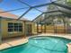Refreshing kidney-shaped pool with screened patio and enclosure at 11158 Golden Silence Dr, Riverview, FL 33579