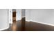 Spacious bedroom with dark wood flooring and an ensuite bathroom at 11158 Golden Silence Dr, Riverview, FL 33579