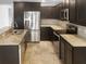 Modern kitchen featuring stainless steel appliances and granite countertops at 11158 Golden Silence Dr, Riverview, FL 33579
