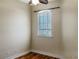 Bright bedroom with hardwood floors and large window at 1340 Apollo Beach S Blvd, Apollo Beach, FL 33572