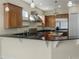 Modern kitchen with granite countertops and stainless steel appliances at 1340 Apollo Beach S Blvd, Apollo Beach, FL 33572
