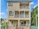 Two-story home with a large balcony, fenced backyard, and attractive facade at 1340 Apollo Beach S Blvd, Apollo Beach, FL 33572