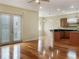 Open living room and kitchen with hardwood floors and French doors at 1340 Apollo Beach S Blvd, Apollo Beach, FL 33572