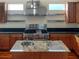 Island kitchen with granite countertops and stainless steel appliances at 1340 Apollo Beach S Blvd, Apollo Beach, FL 33572