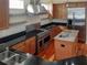 Gourmet kitchen featuring stainless steel appliances and hardwood floors at 1340 Apollo Beach S Blvd, Apollo Beach, FL 33572