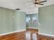 Bedroom with hardwood floors and multiple windows with water view at 1340 Apollo Beach S Blvd, Apollo Beach, FL 33572