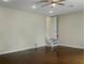 Large bedroom with concrete floors and a staircase at 1340 Apollo Beach S Blvd, Apollo Beach, FL 33572