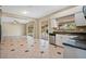 Kitchen with stainless steel appliances and view of Gathering room at 18509 Bittern Ave, Lutz, FL 33558