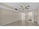 Second bedroom with ceiling fan and access to closet at 6400 46Th N Ave # 102, Kenneth City, FL 33709