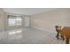 Living room with tile floors and access to exterior at 6400 46Th N Ave # 102, Kenneth City, FL 33709