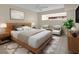 Main bedroom with stylish furniture and natural light at 6400 46Th N Ave # 102, Kenneth City, FL 33709