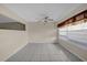 Bright living room featuring tile floors and window blinds at 6400 46Th N Ave # 102, Kenneth City, FL 33709