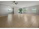 Open living room with tile floors and sliding glass doors leading to the outdoors at 7510 39Th E Ave, Palmetto, FL 34221