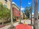 Apartment building exterior with palm trees and a fire hydrant at 1810 E Palm Ave # 1105, Tampa, FL 33605